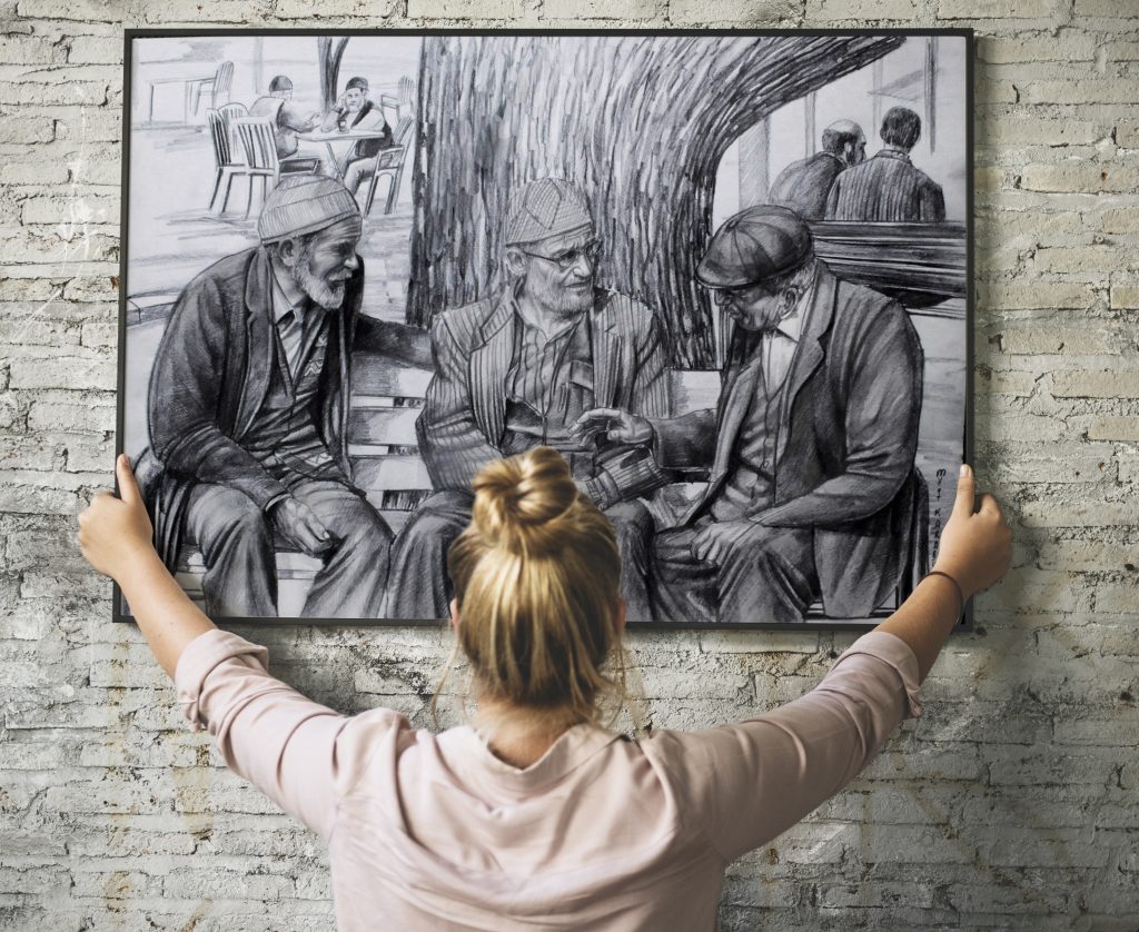 Blonde girl holding a mockup frame